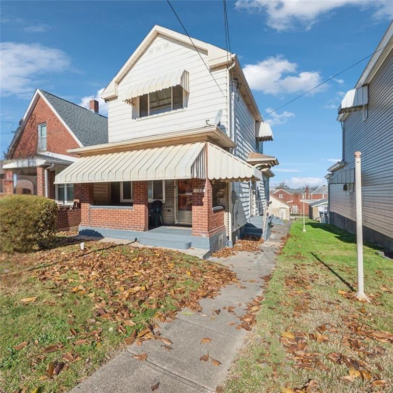 a house with yard in front of it