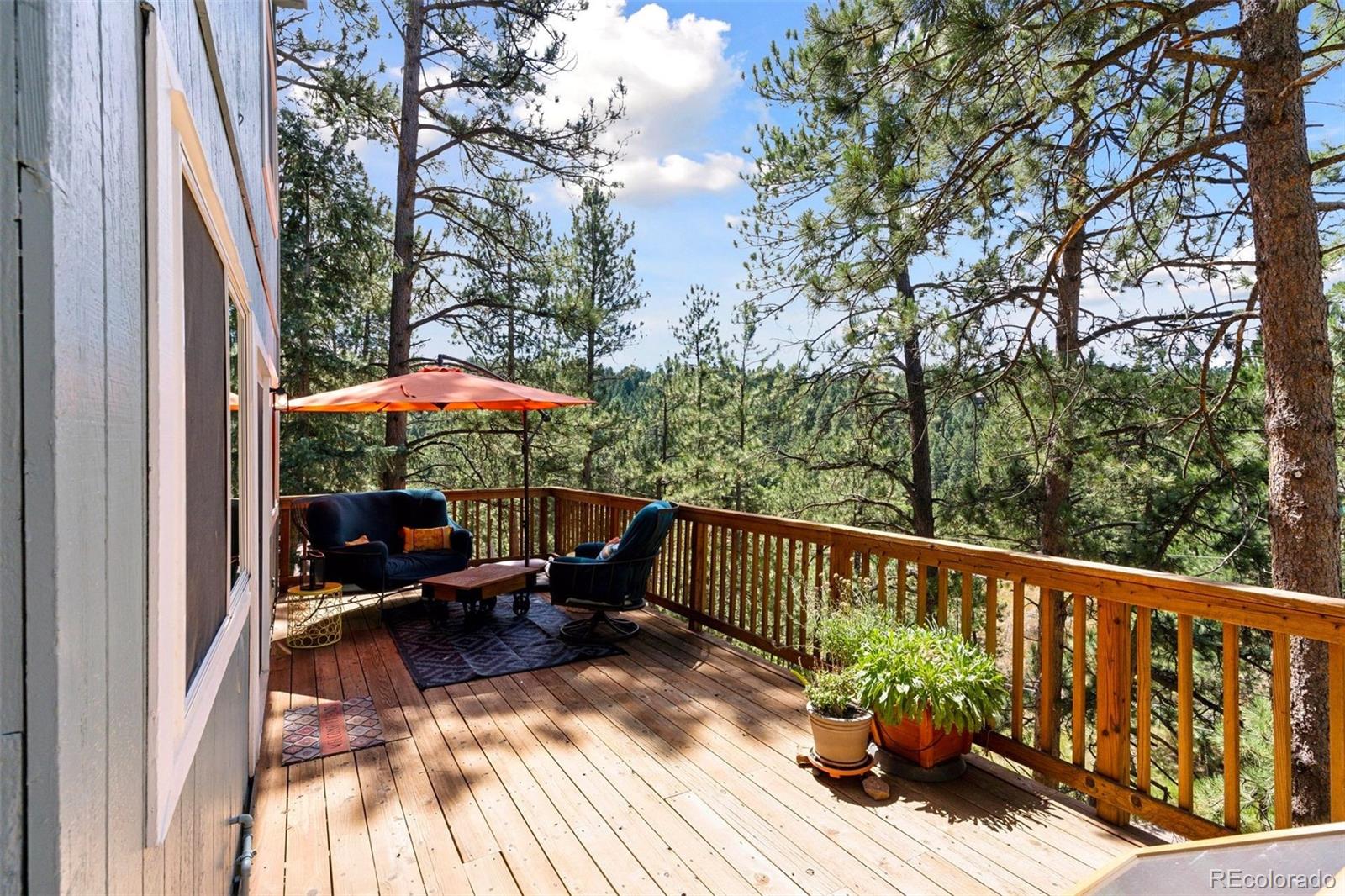 a view of balcony with furniture and wooden floor