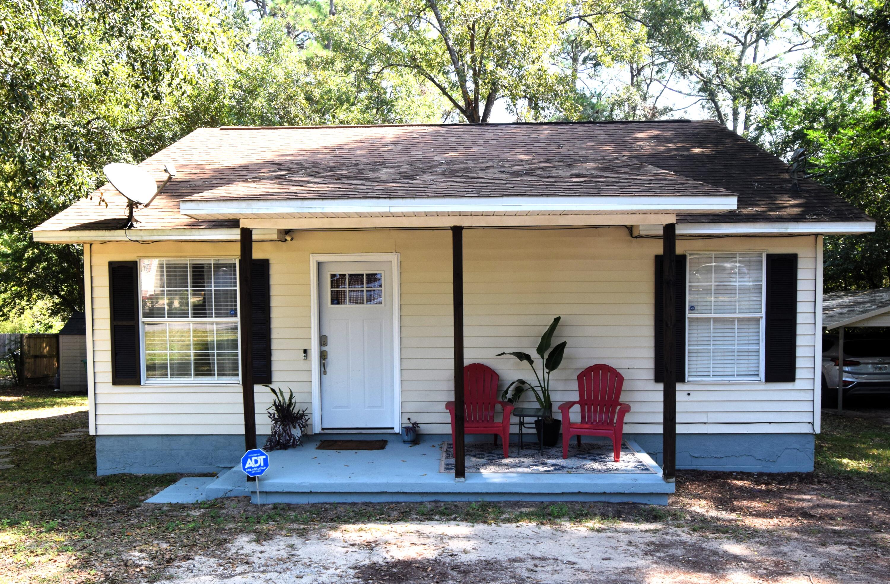 a front view of house with street