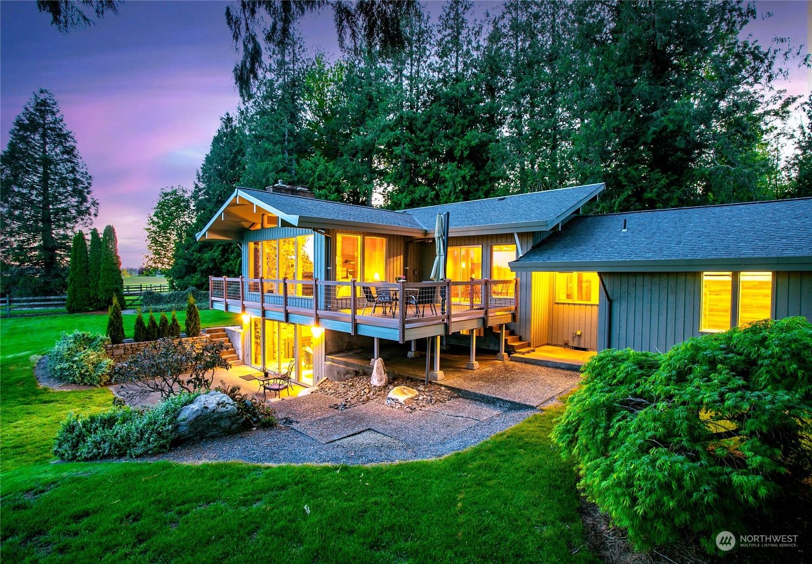 an outdoor space with furniture and garden