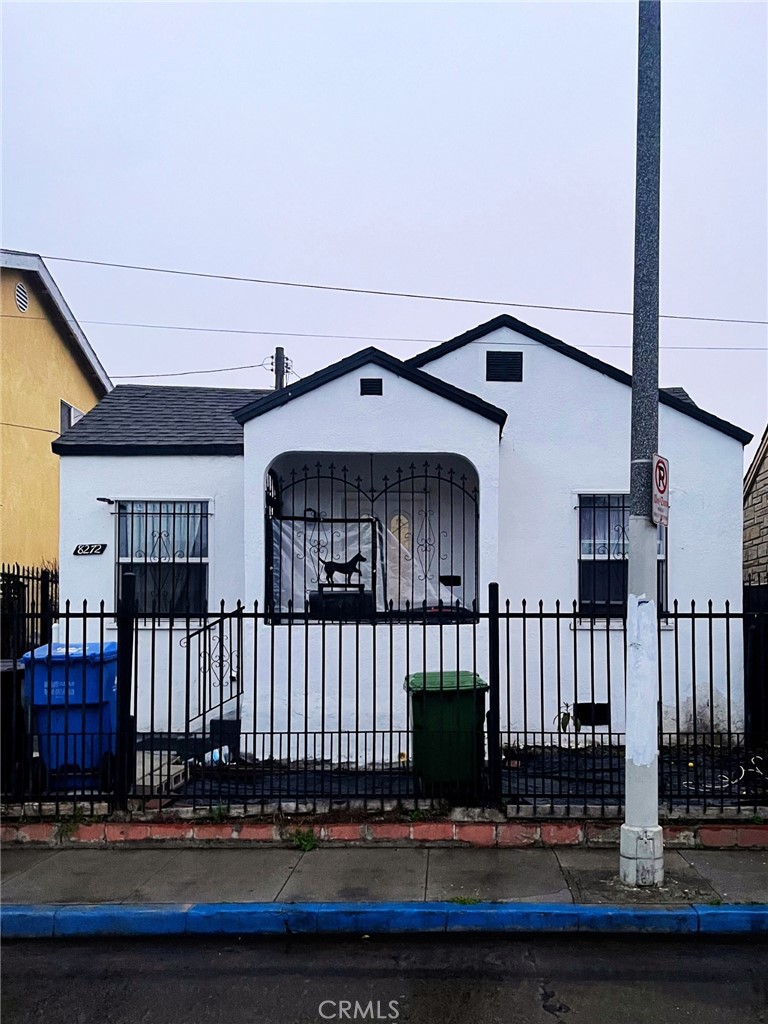 a view of a house with a small deck