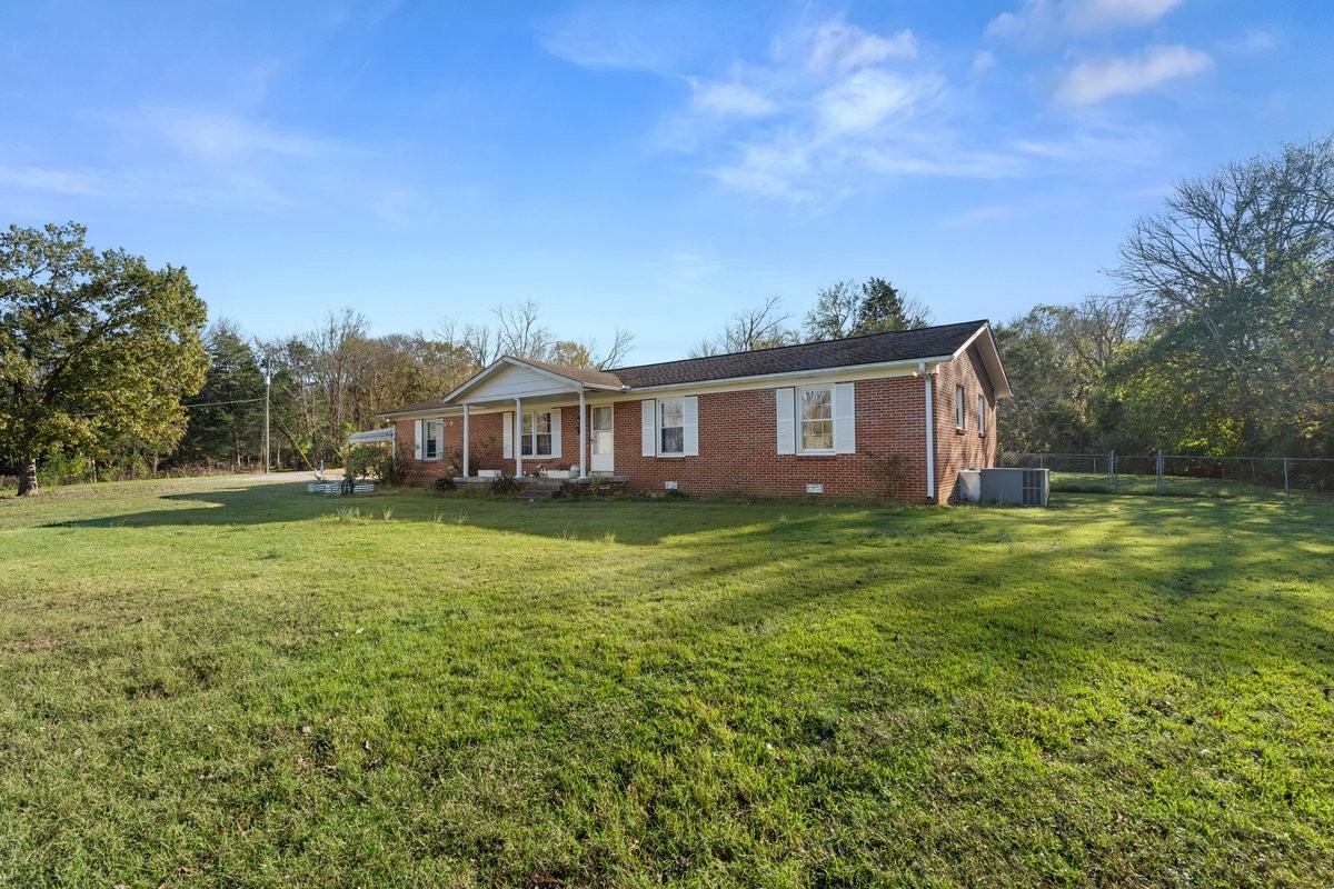 a view of a house with a big yard