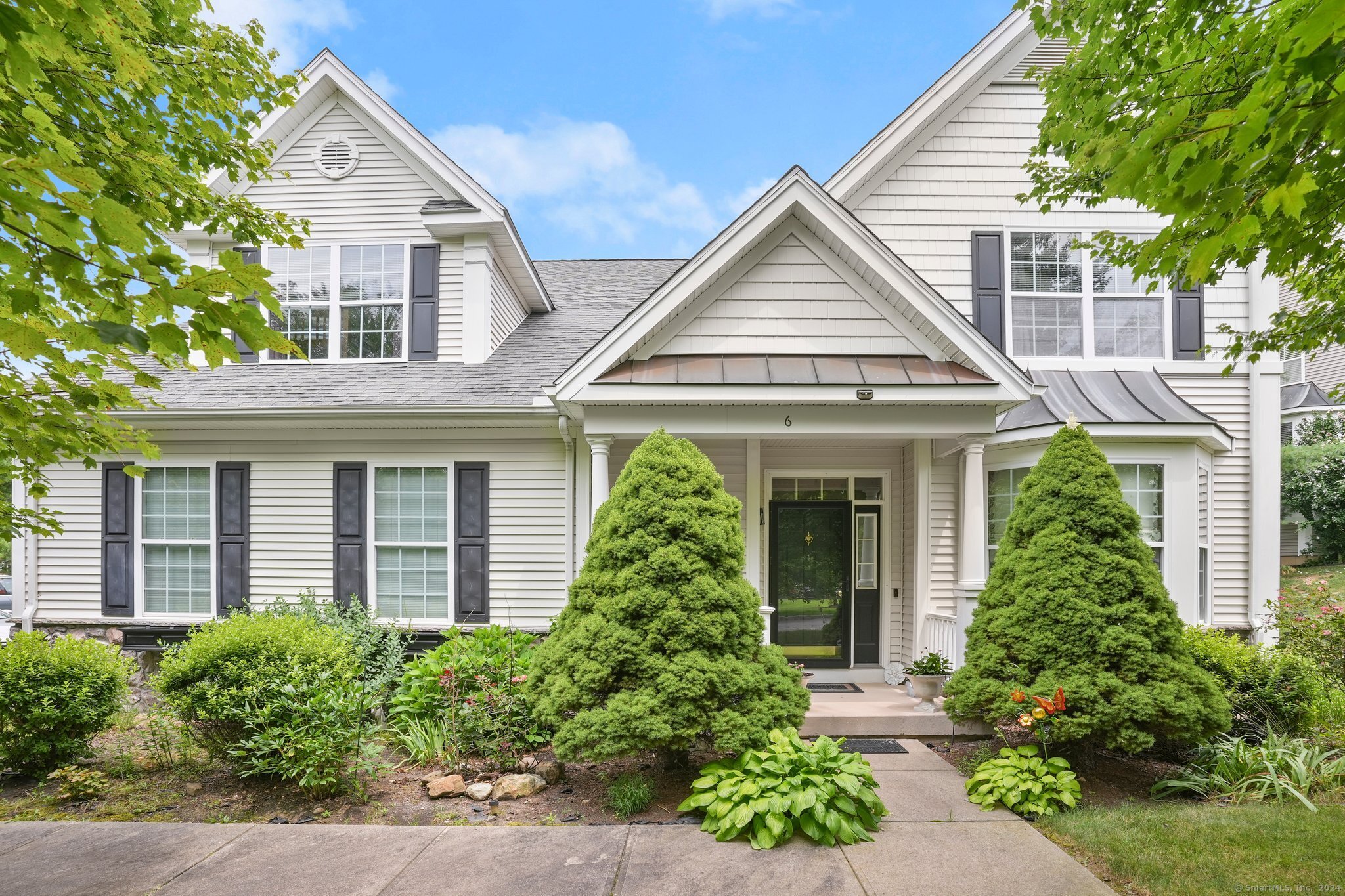 front view of a house with a yard