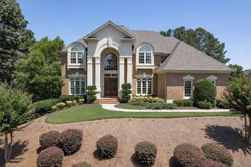 a front view of a house with a yard