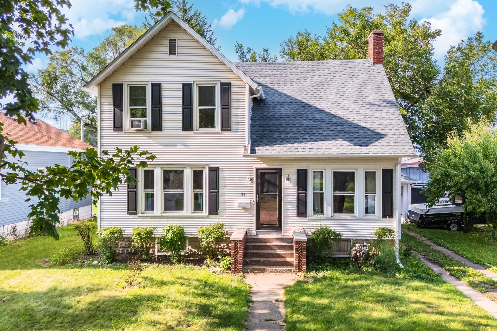 a front view of a house with a yard