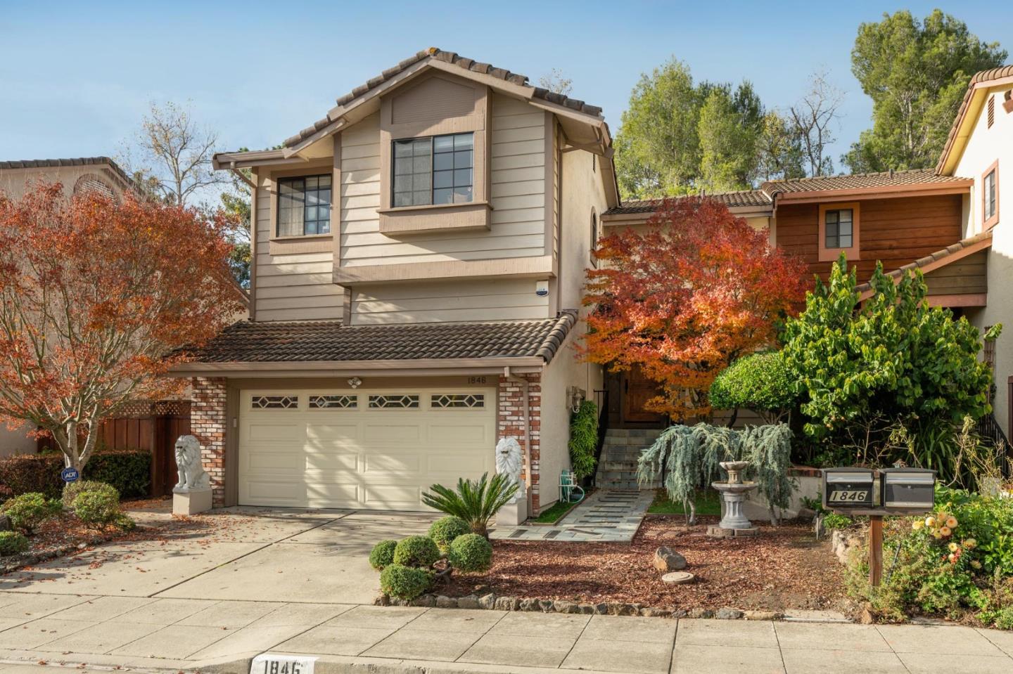 a front view of a house with garden