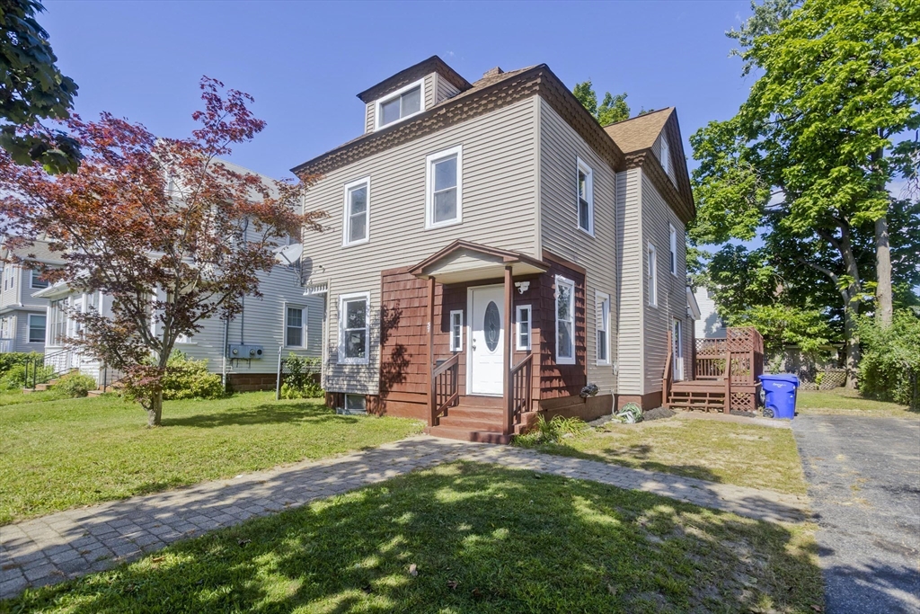 a front view of a house with a yard