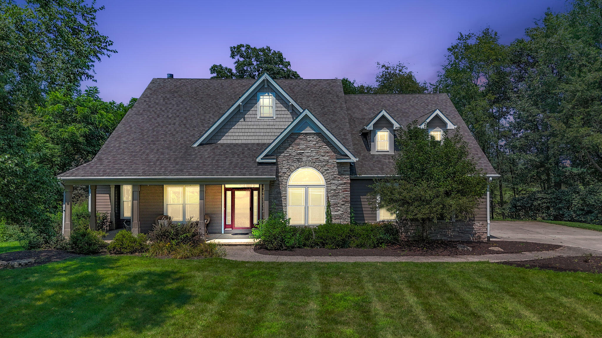 a front view of a house with a yard