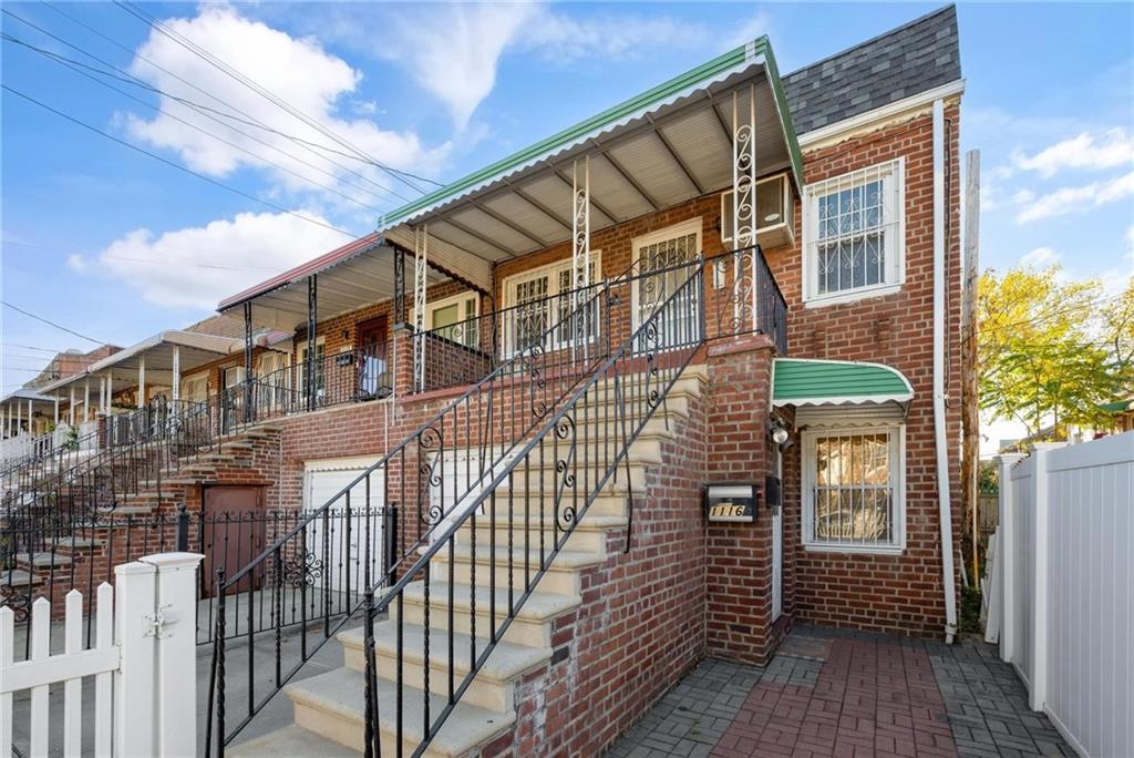 a view of a brick house with a small space