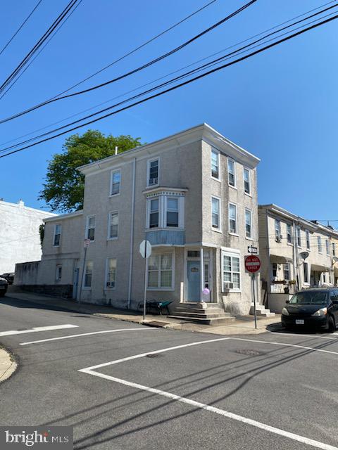 a view of a building with a street