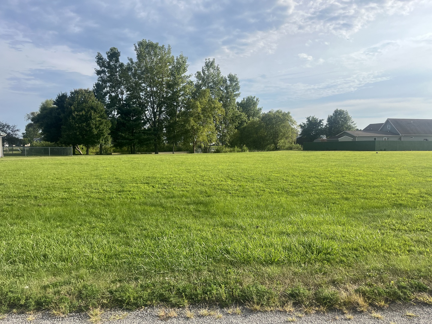 a view of an ocean and a yard