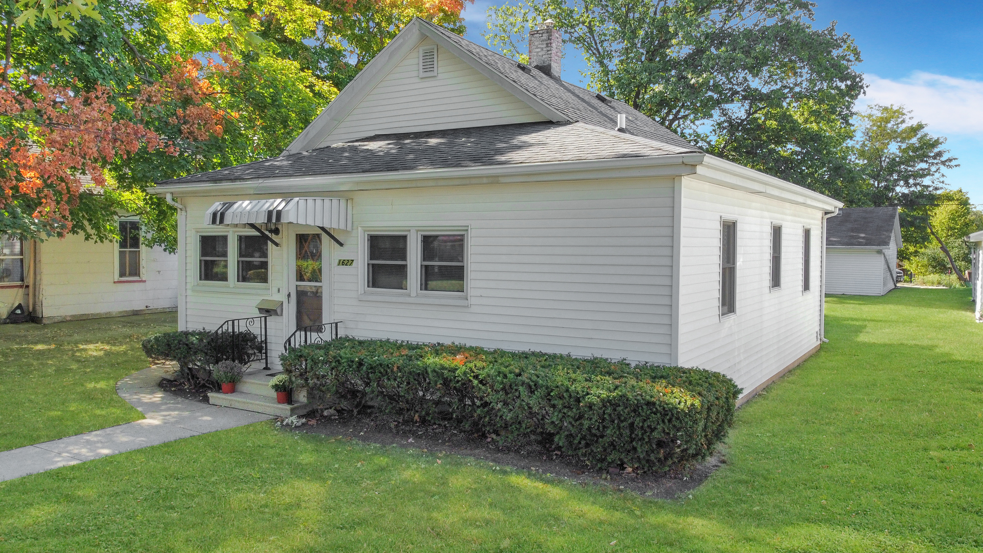 a front view of a house with garden