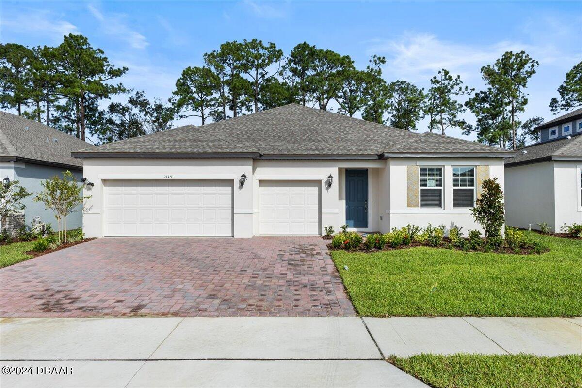 front view of a house with a yard