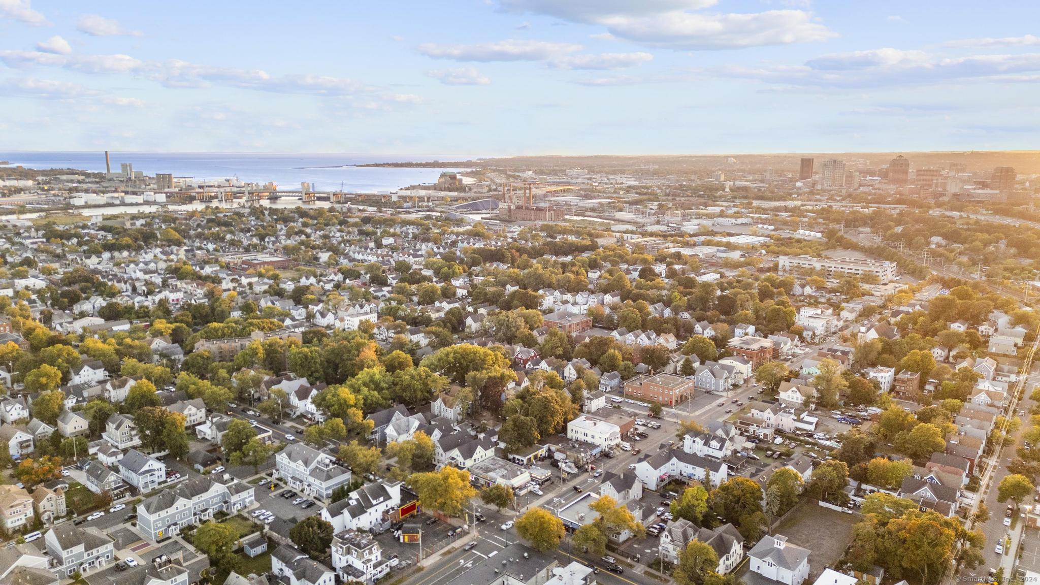 an aerial view of residential building with yard