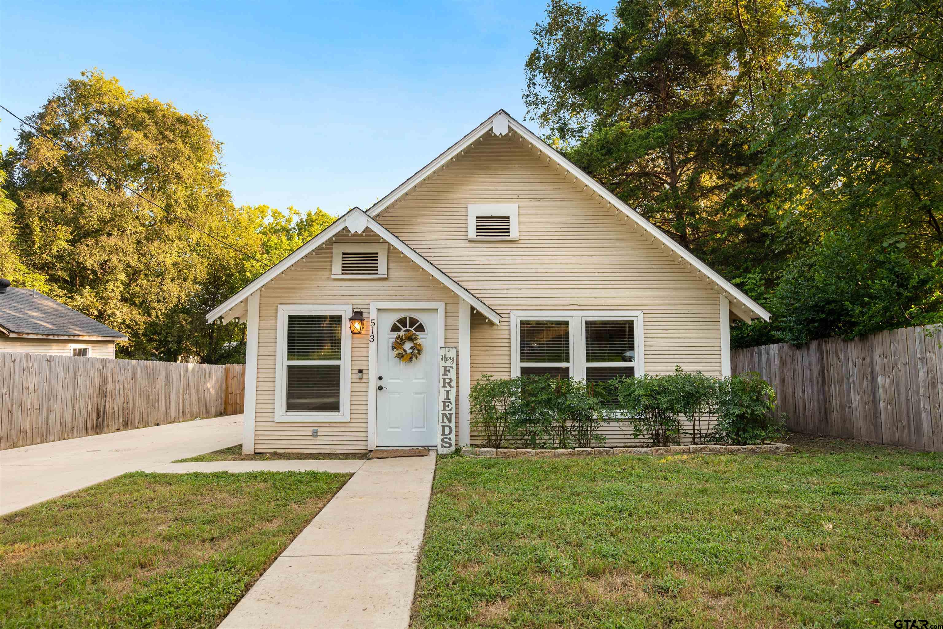 a view of a yard in front view of a house