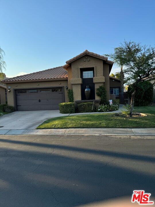 a view of a house and a yard