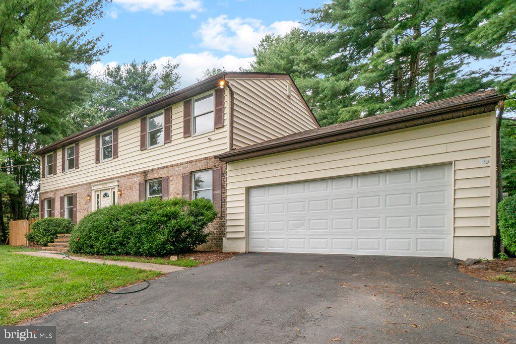 a front view of a house with a garage