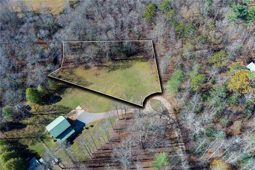 a bird view of house with outdoor space