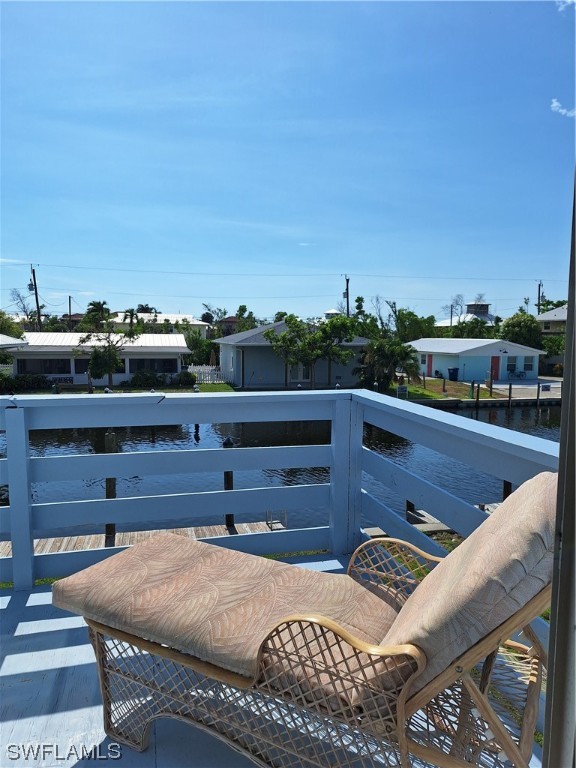 a view of a terrace with wooden floor and city view