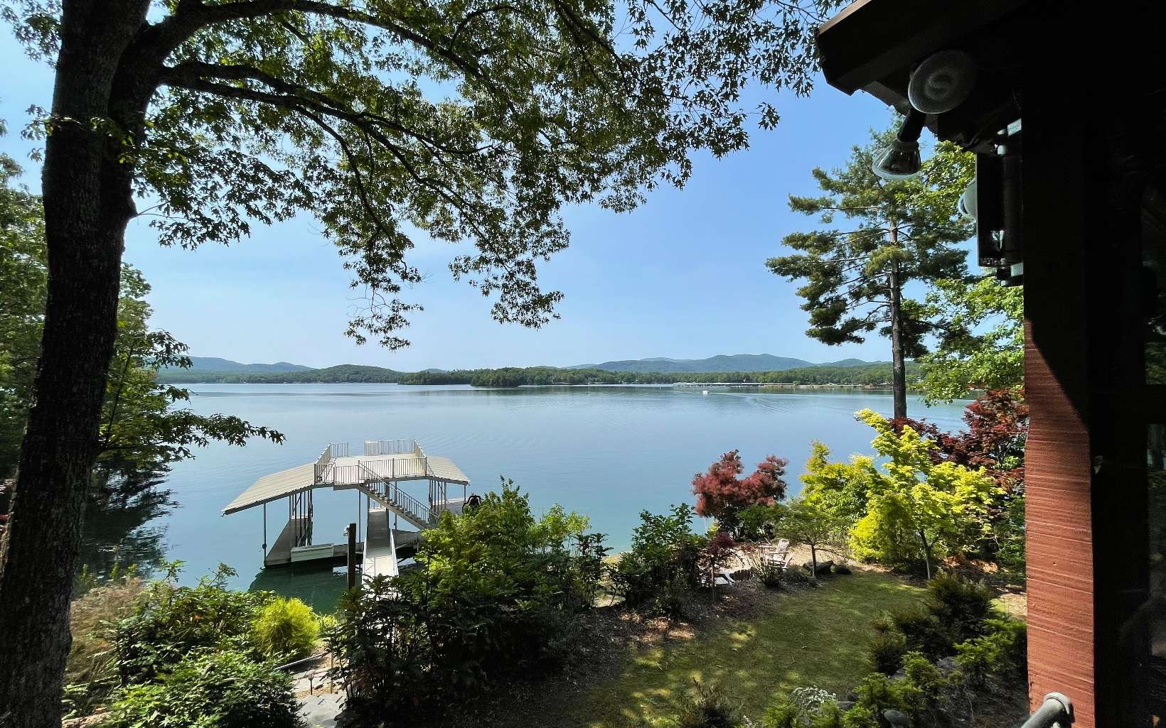 an aerial view of a house with a lake view