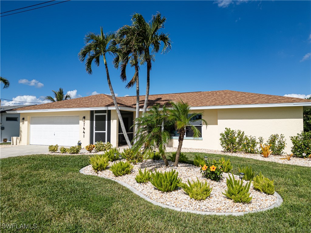 a front view of a house with garden