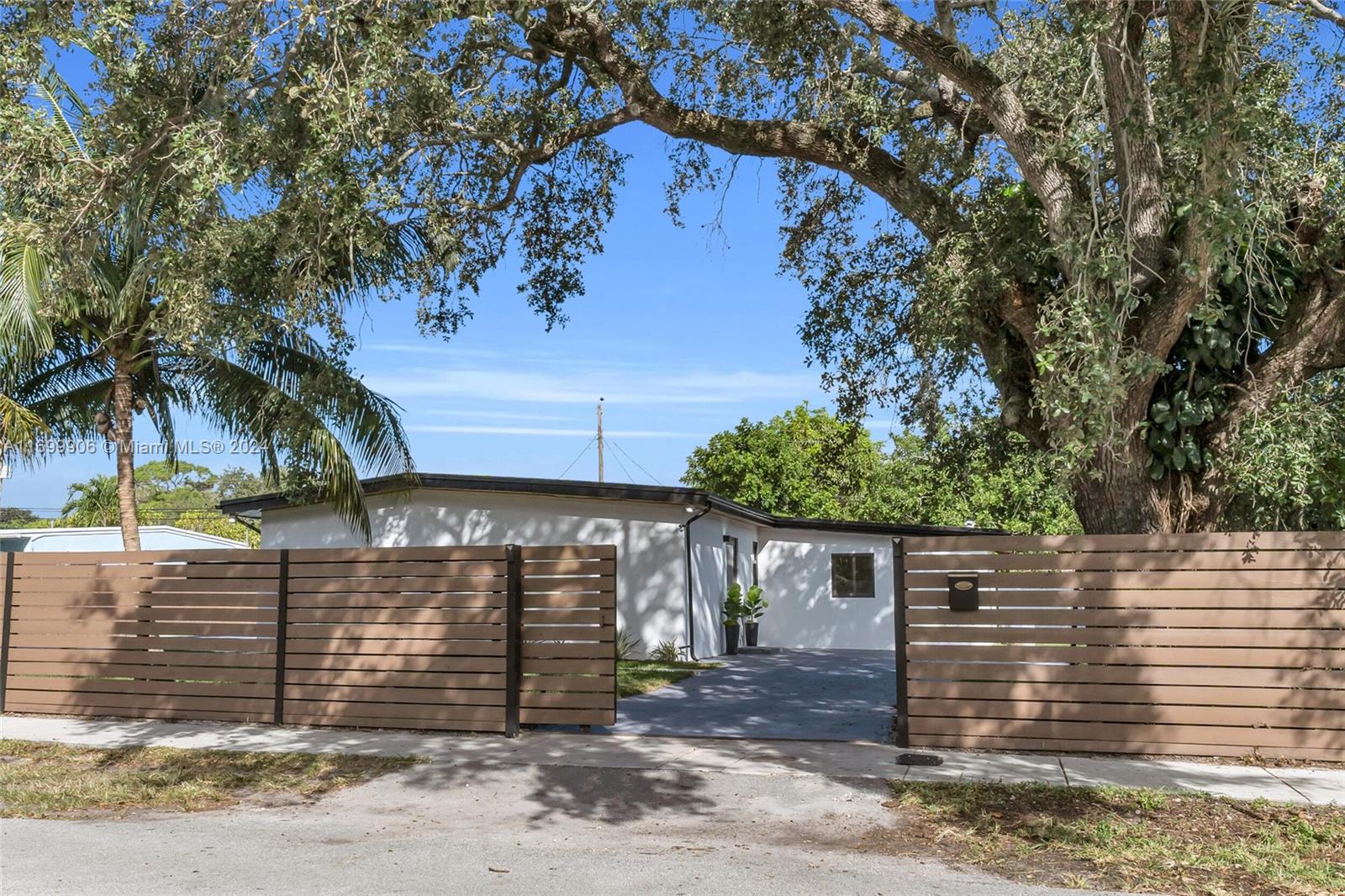 a view of a house with a tree