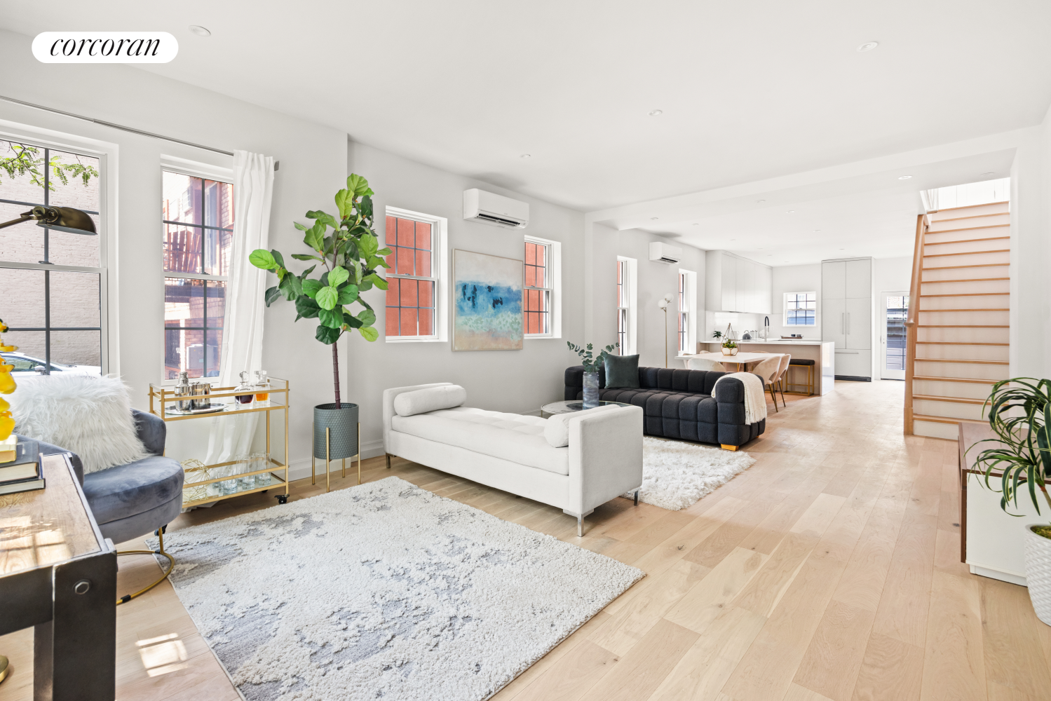 a living room with furniture or couch and a potted plant