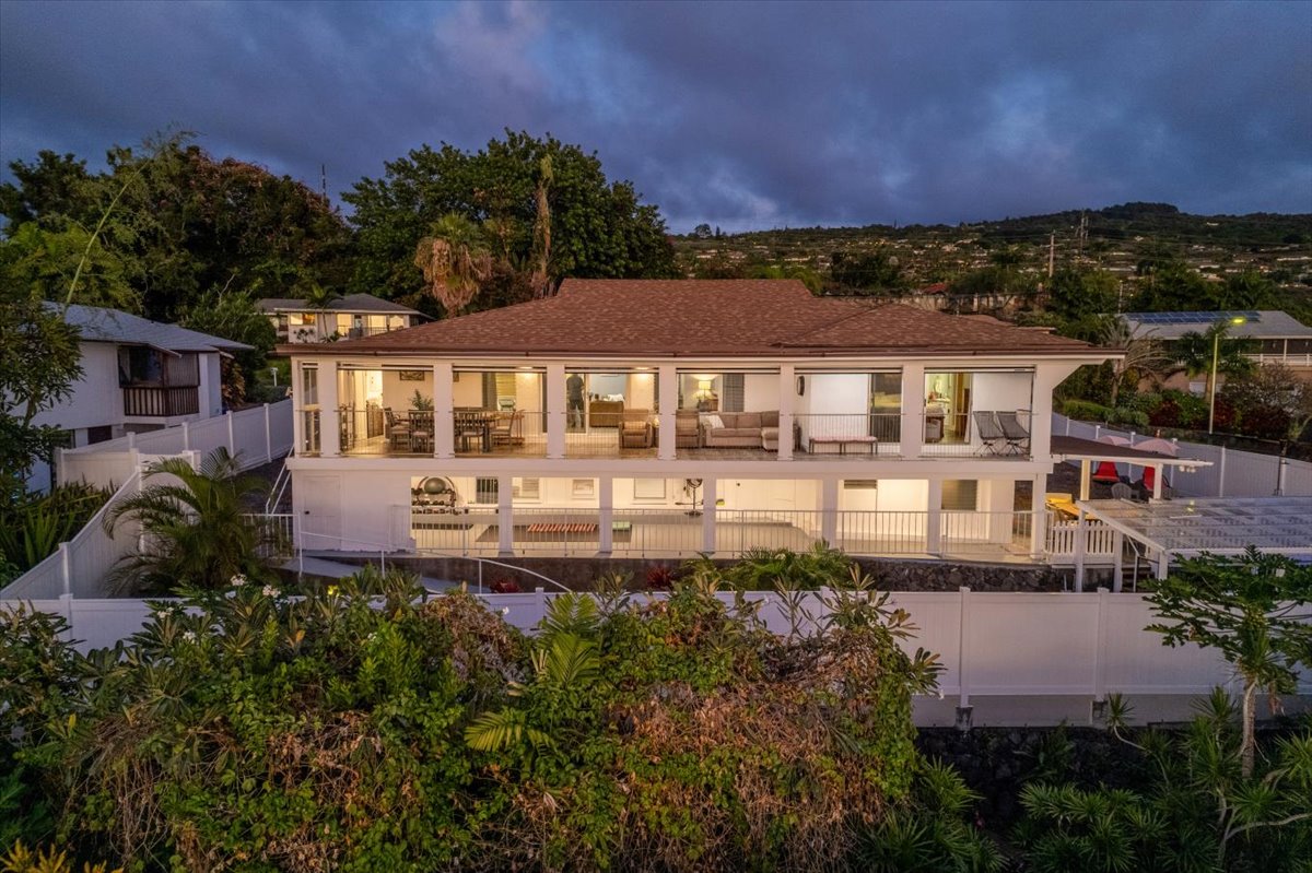 an aerial view of a house with a garden and a yard