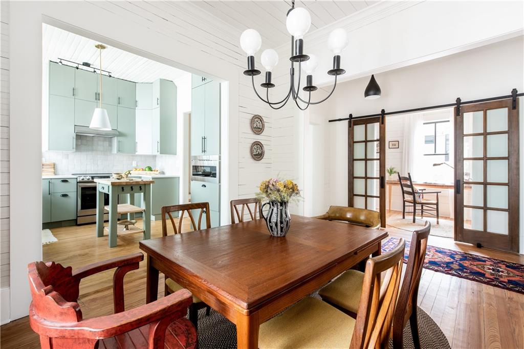 a view of a dining room with furniture window and wooden floor