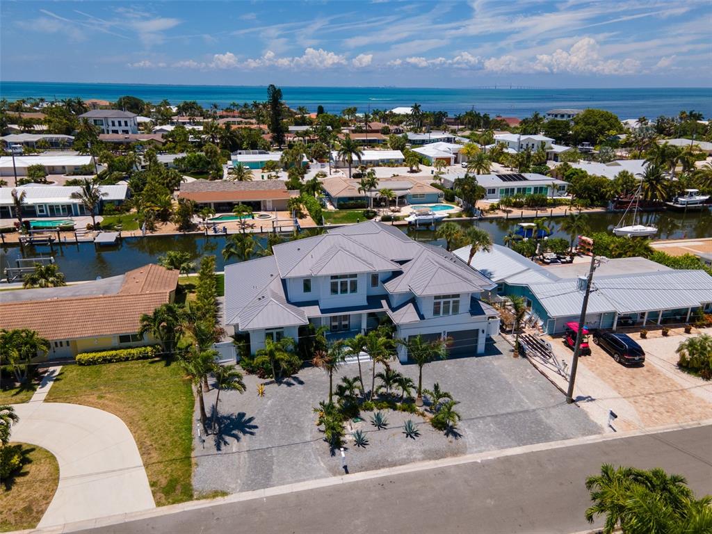 an aerial view of a houses with a lake view