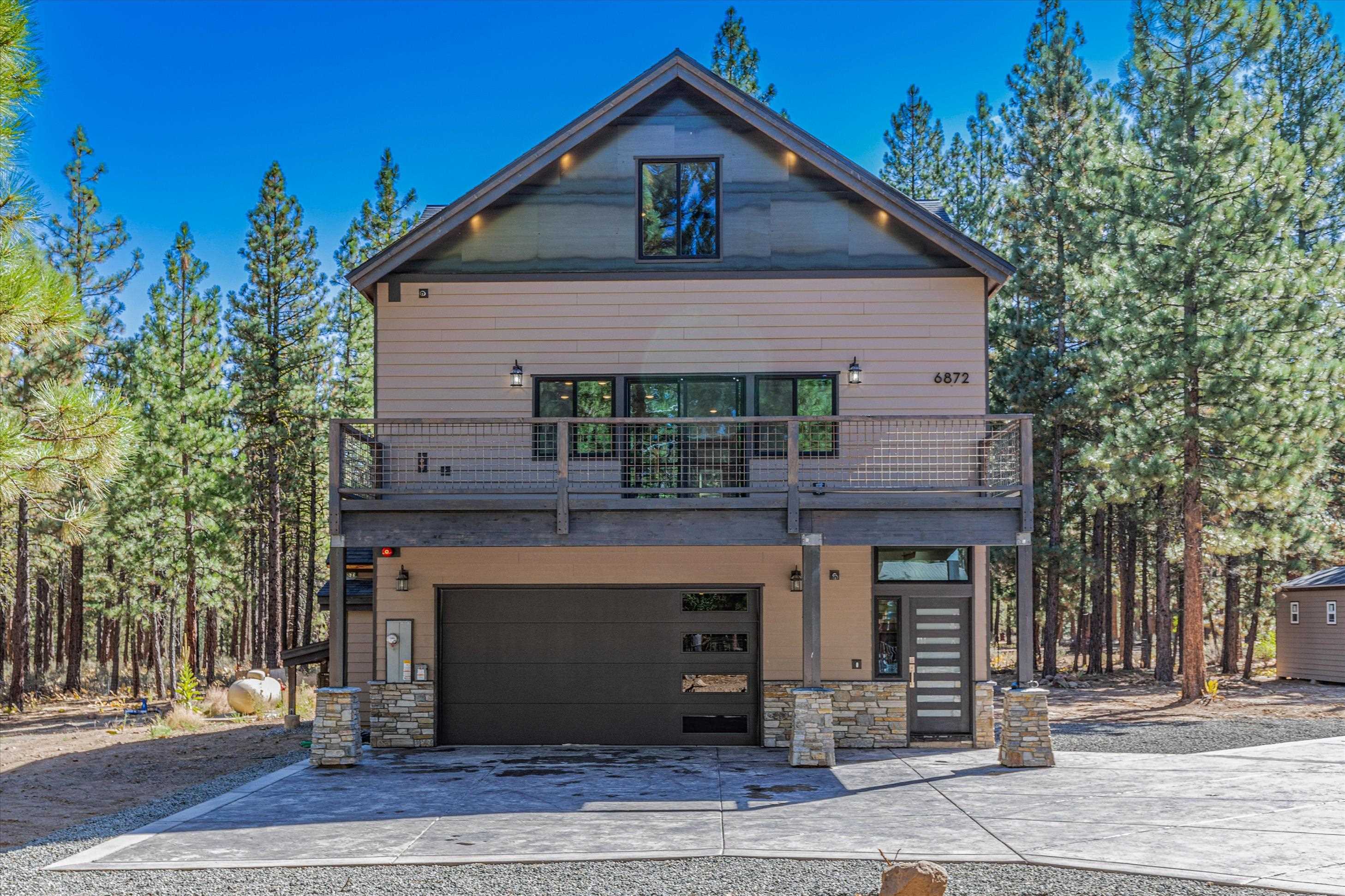 a front view of a house with garage