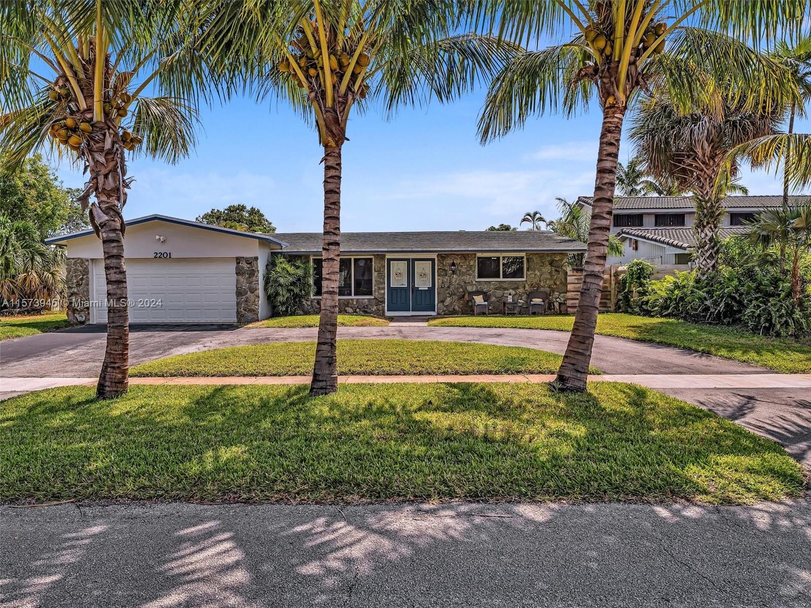 Gorgeous curb appeal with circular driveway