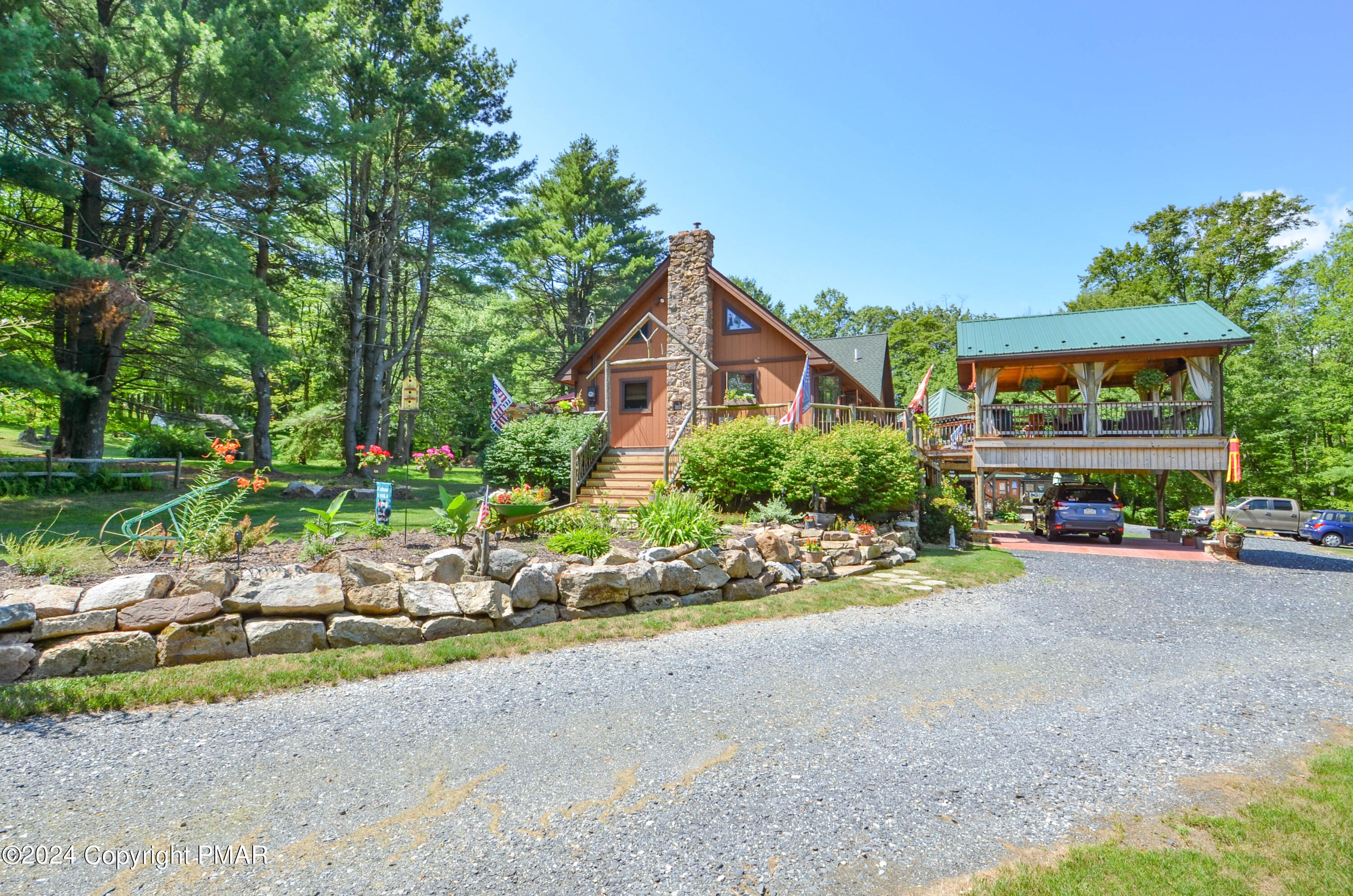 a front view of a house with a yard and a garage