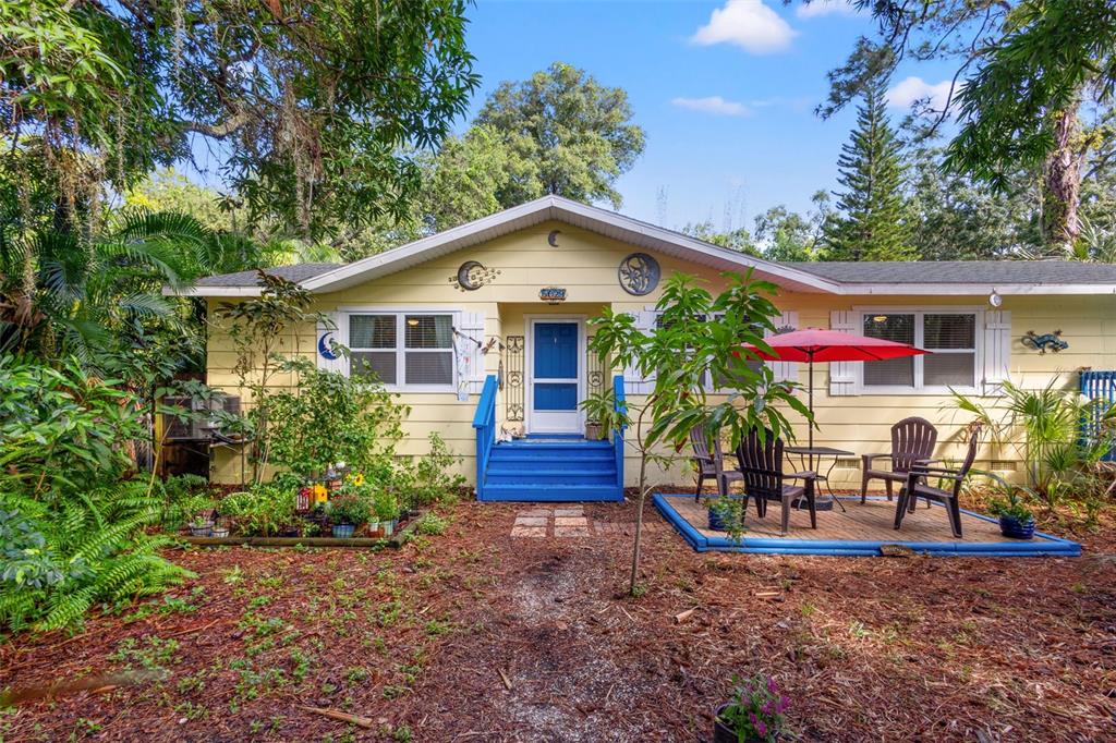 a front view of a house with garden