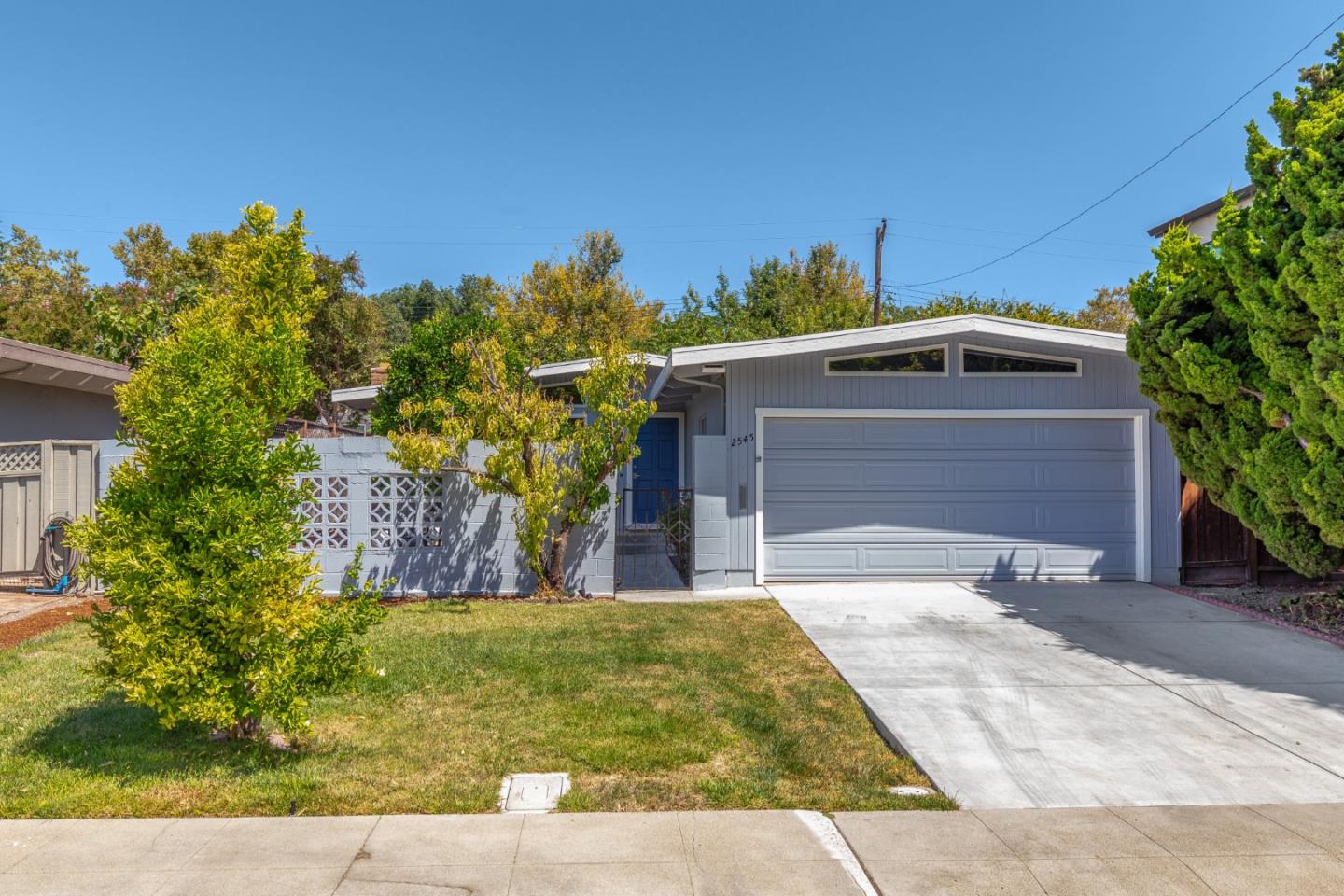 a front view of a house with a yard