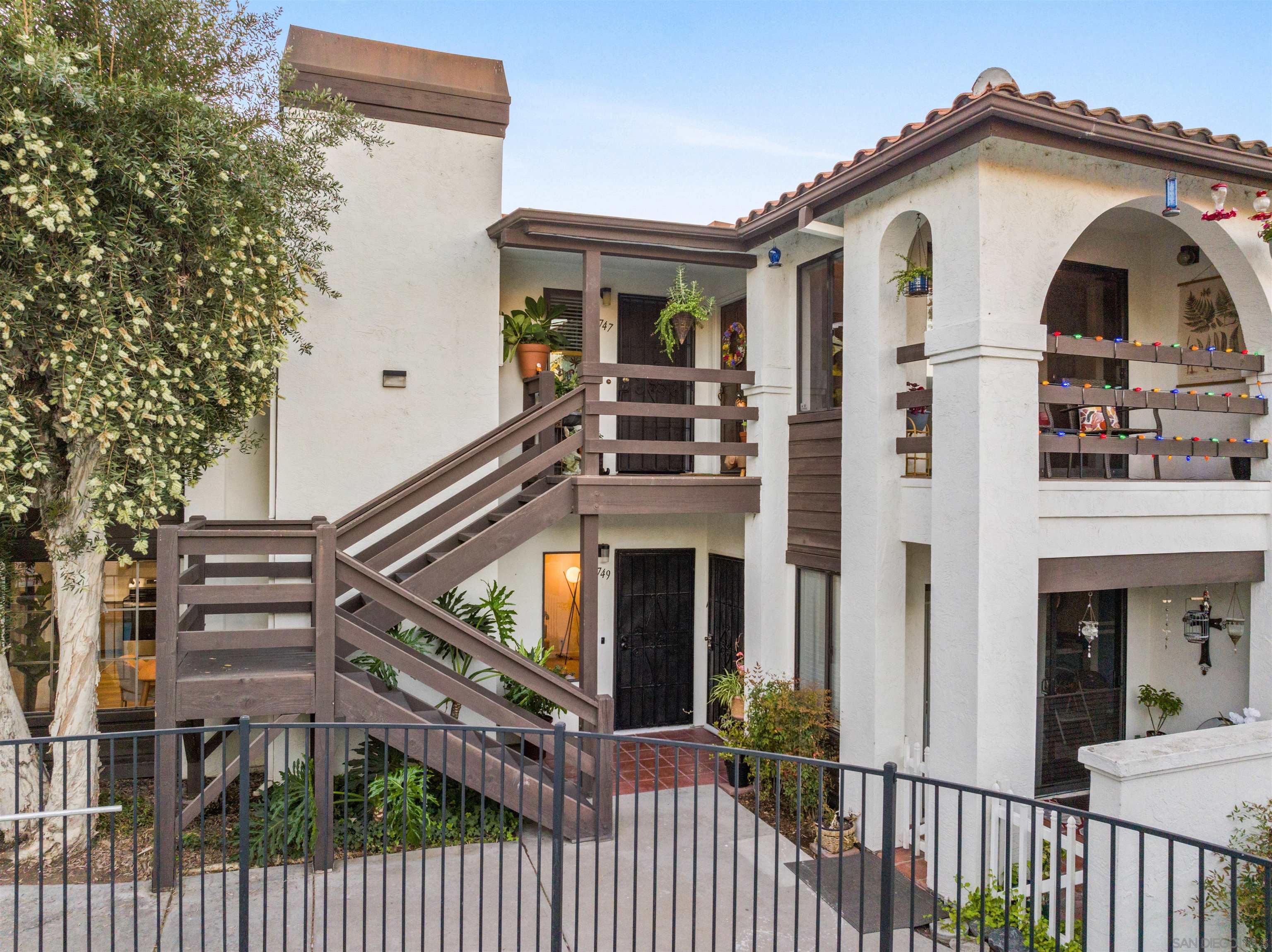 a view of a house with iron stairs