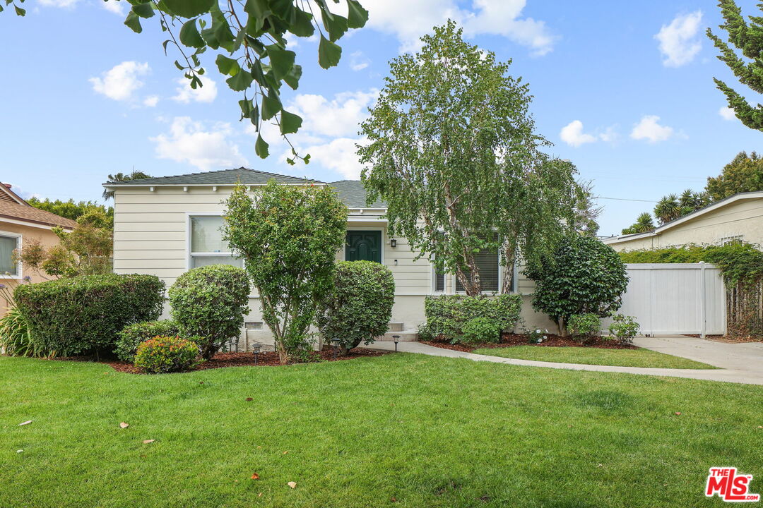 a view of a house with a garden