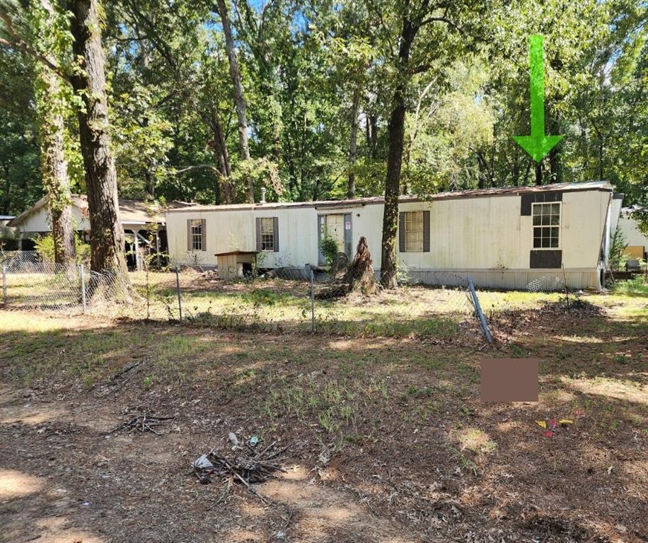 a backyard of a house with shaded area