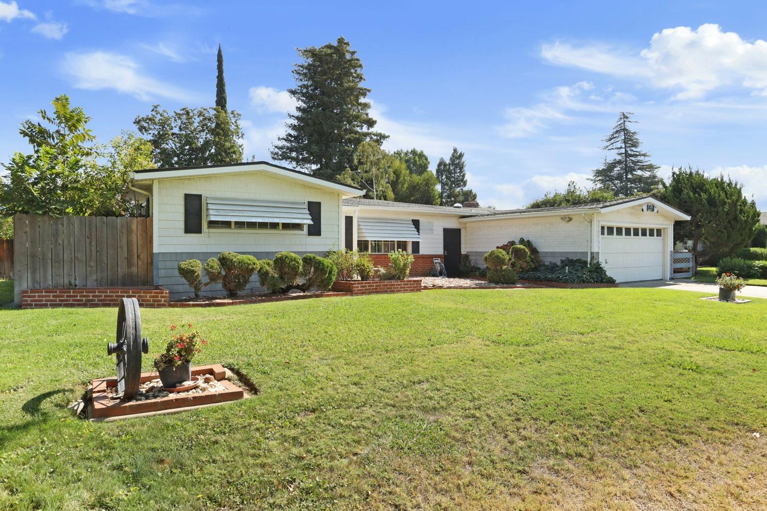 a front view of a house with garden