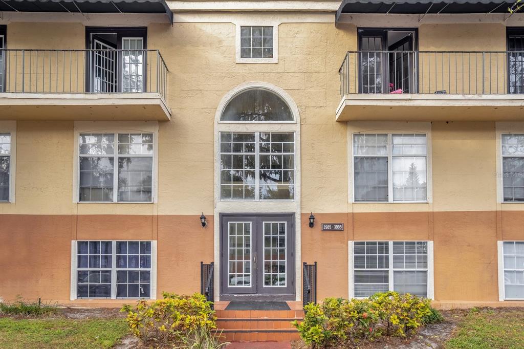 front view of a brick house with a windows