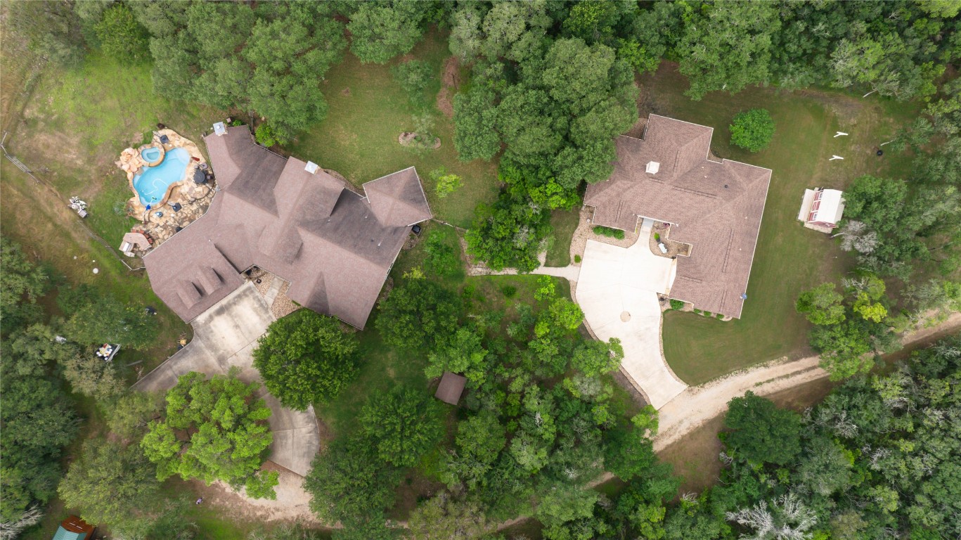 an aerial view of a house with a lake view