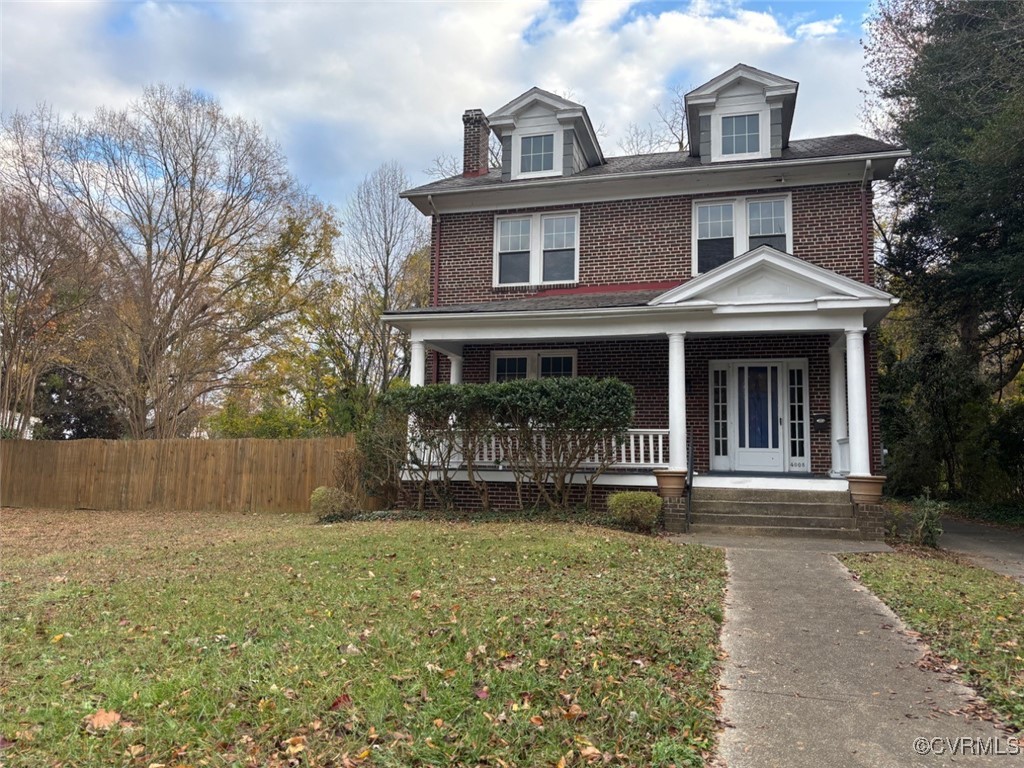 View of front facade with covered porch and a fron