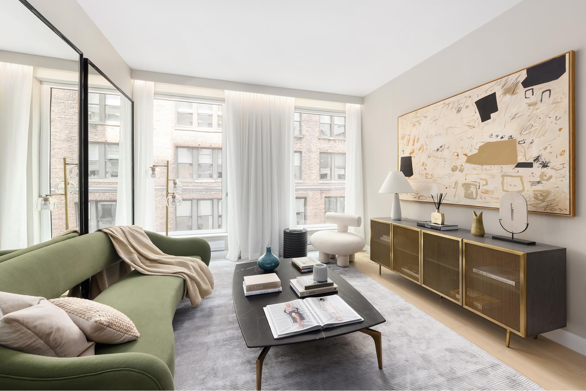 a living room with furniture and a floor to ceiling window