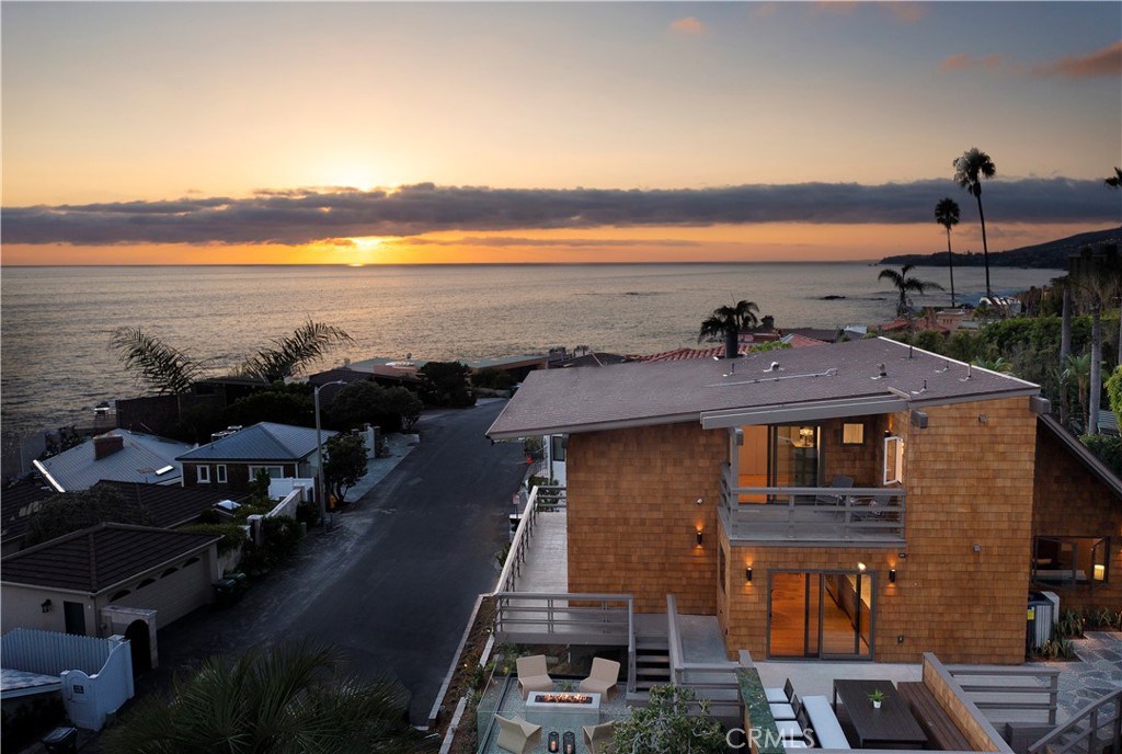 a front view of a house with a ocean view