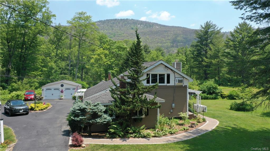 a view of a house with a sink and a yard