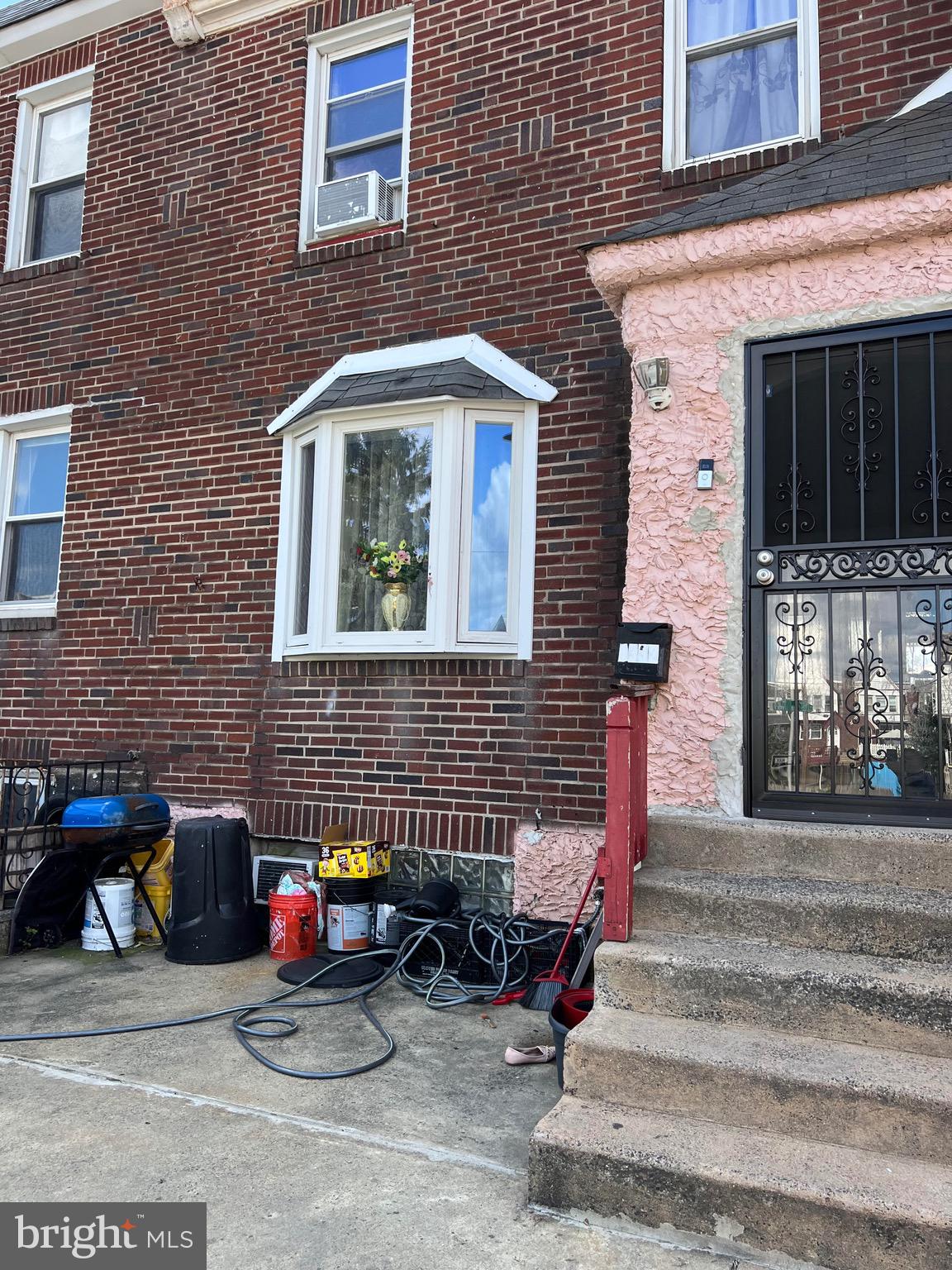 a view of a brick house with many windows