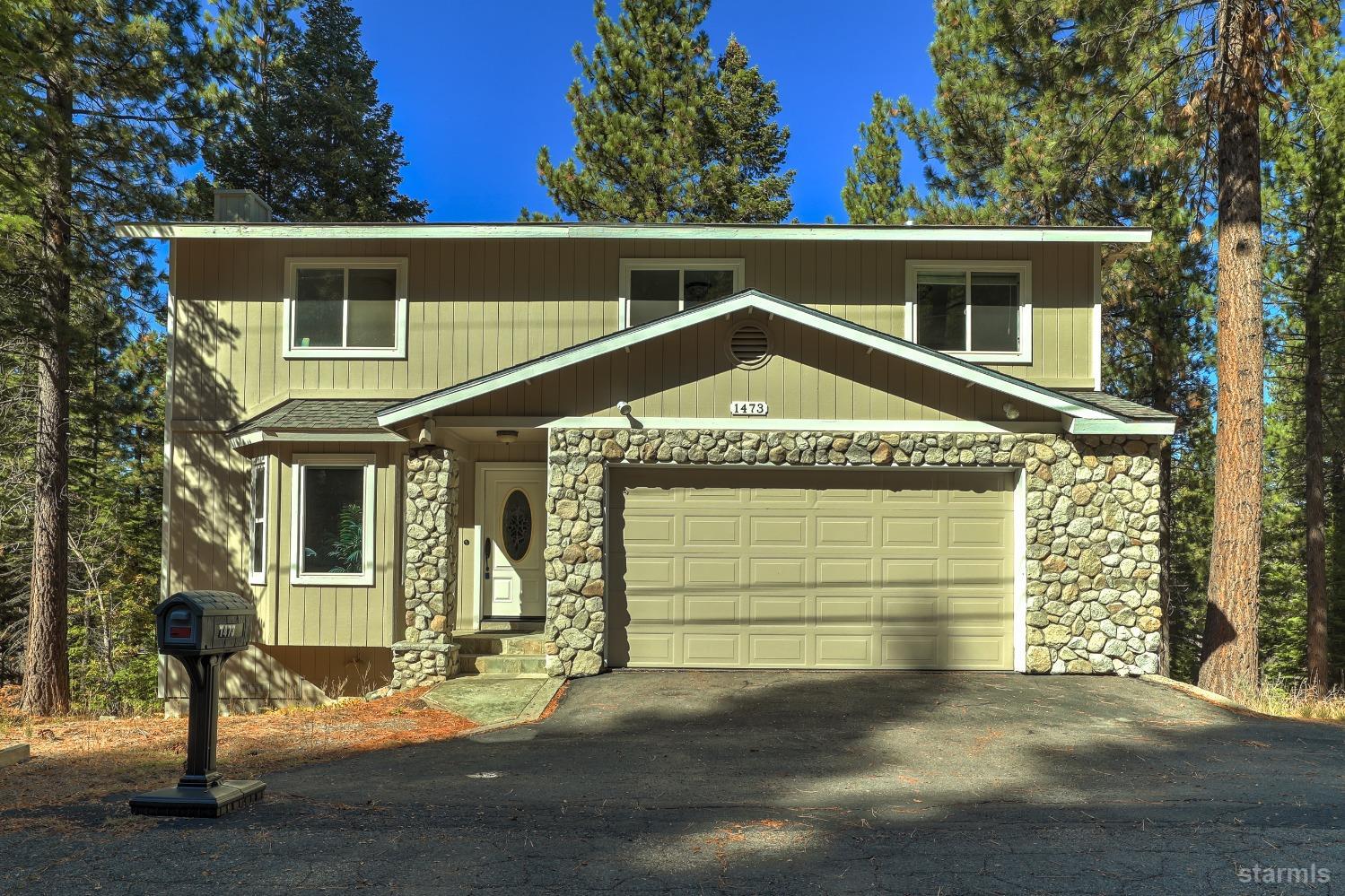 a front view of a house with a garage