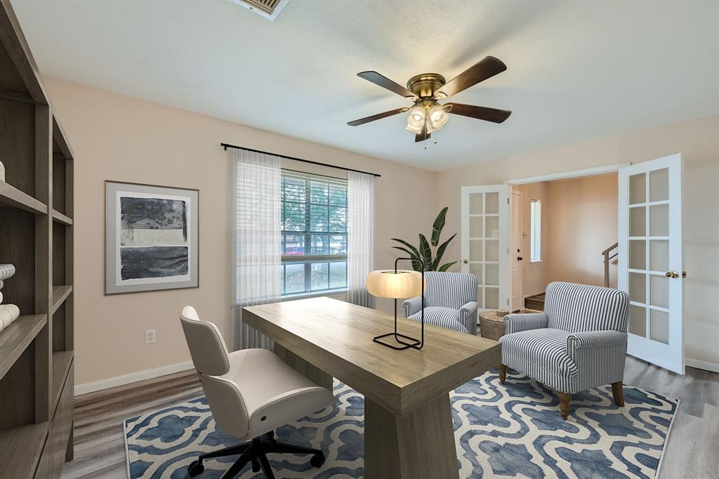 a view of a dining room with furniture and window