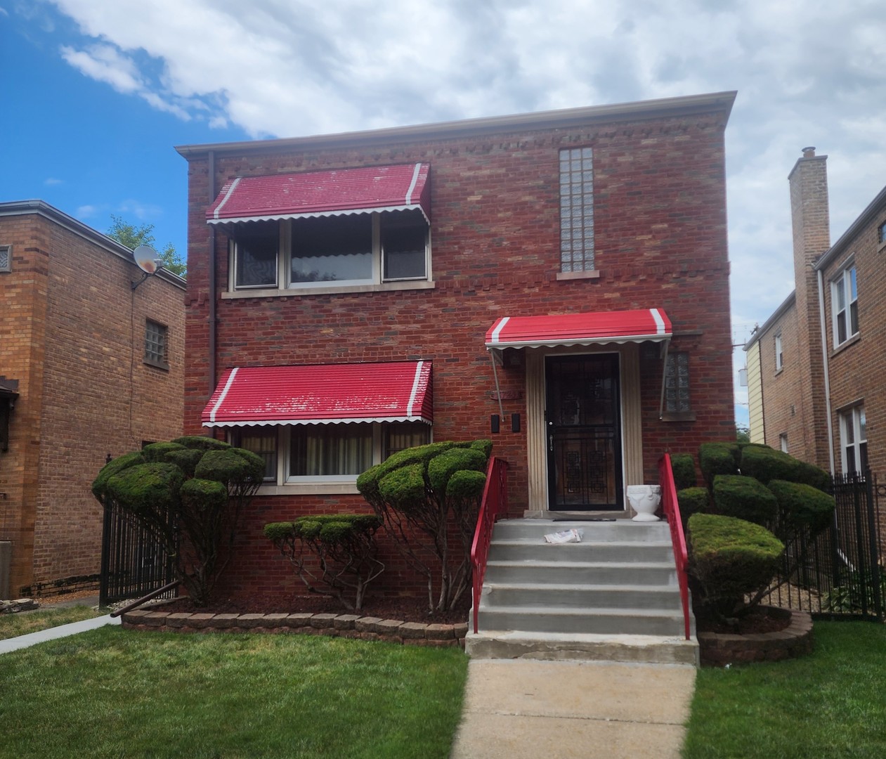 a front view of a house with a yard