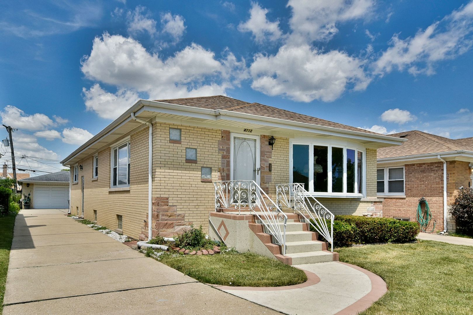 front view of a house with a yard